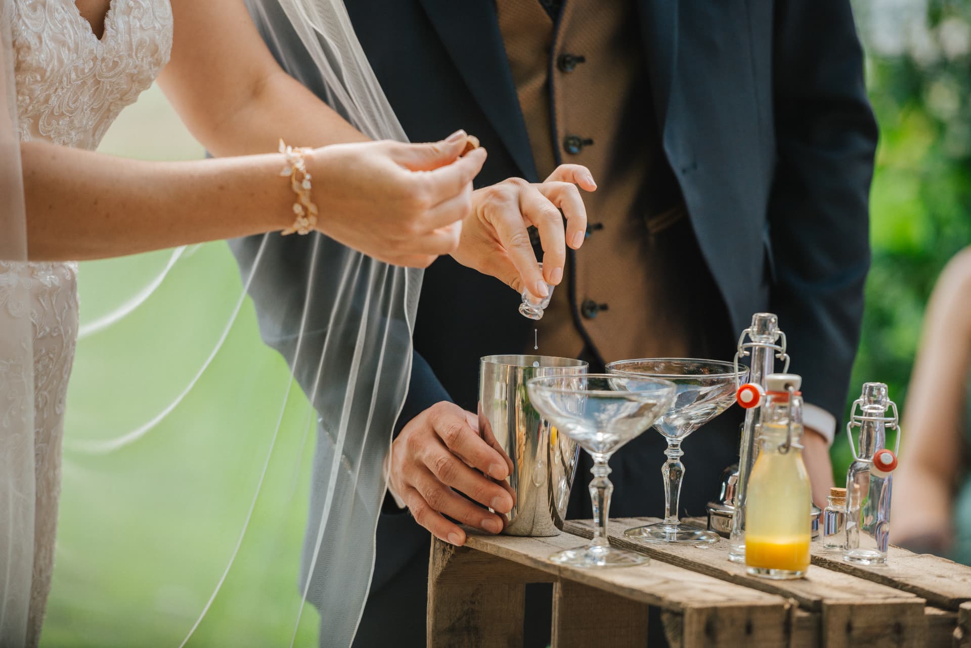 A couple adding ingredients to a cocktail during their wedding ritual
